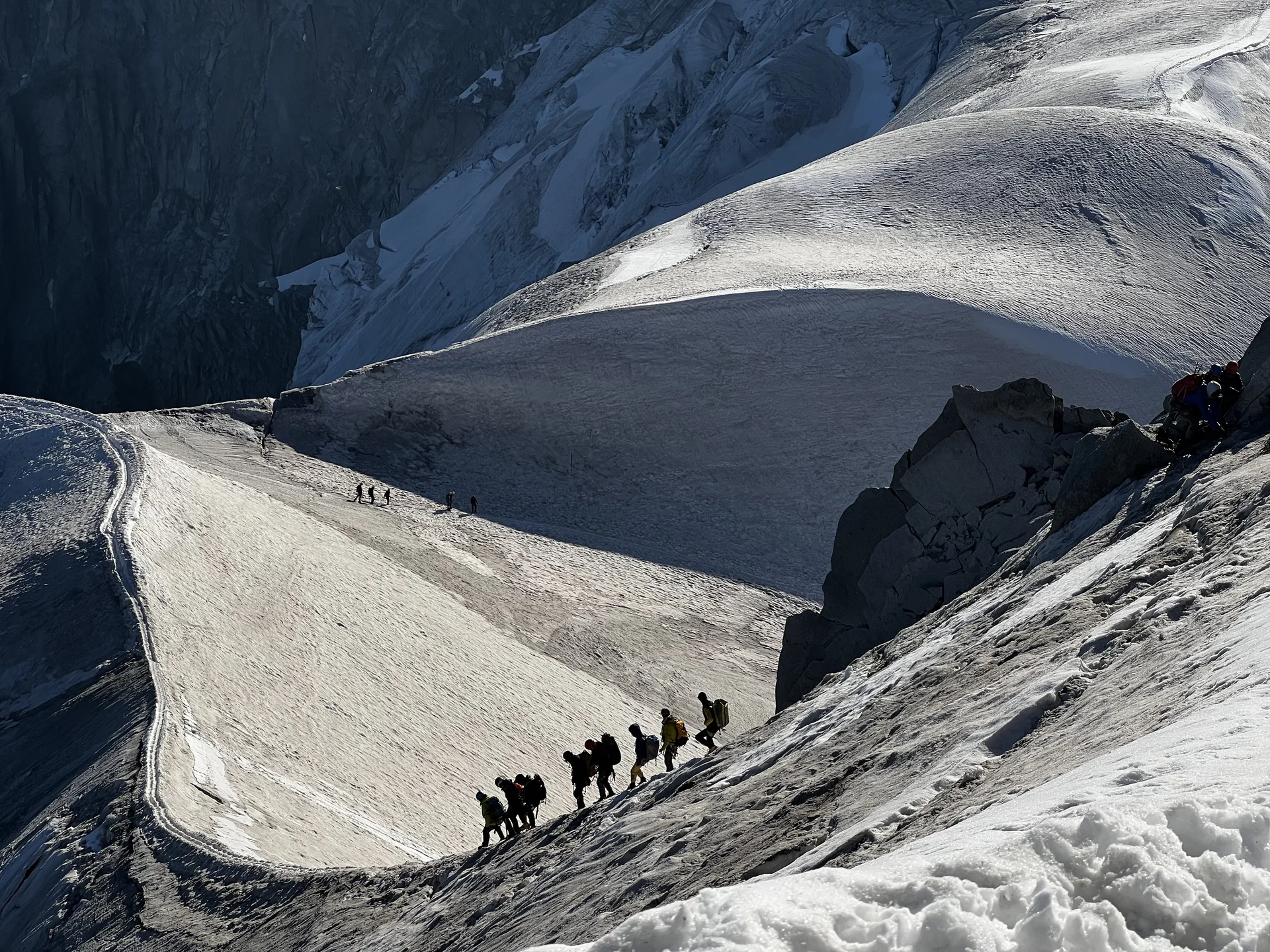 climbing a snowy peak